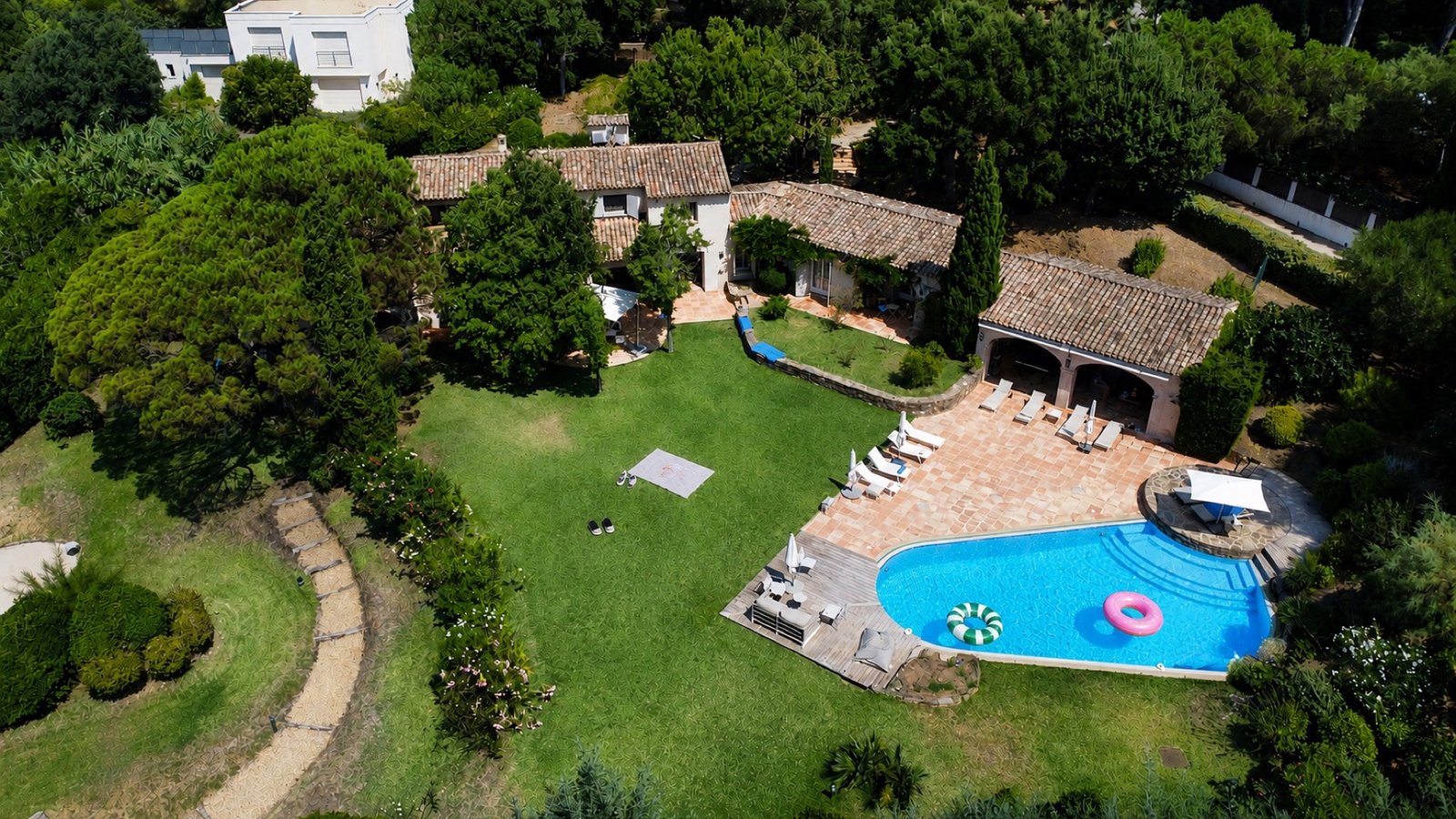 Unedited drone photo of a villa and pool, before editing